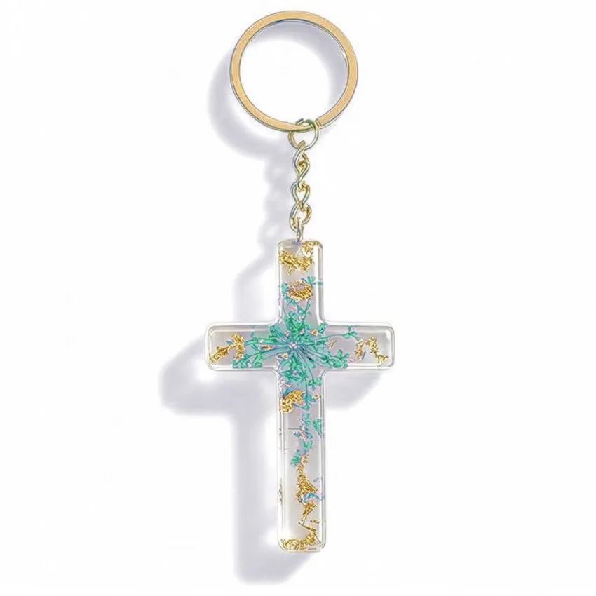 Porte clé croix avec inclusions de fleurs - turquoise